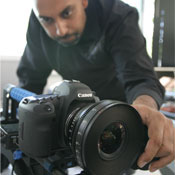 Snehal Patel adjusting settings on the Canon DSLR 5D